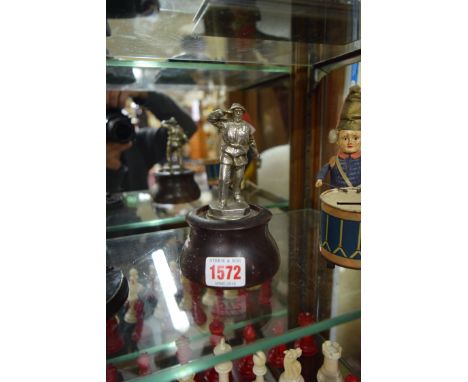 A vintage nickel plated 'Lifeboatman' car mascot, 9.5cm high, on a turned treen base. 