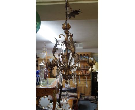 An old brass and faceted glass drop three branch ceiling light.