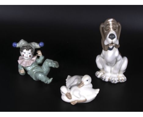 Three pieces of Nao porcelain, A dog 7" tall a duck and a clown