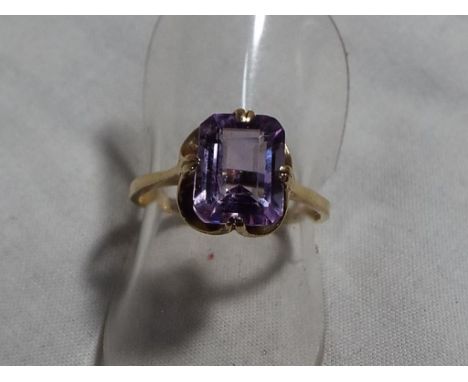 A lady's hallmarked 9 carat gold and amethyst ring, size L and a half, approximate weight 1.9 grams, boxed