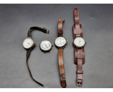 Four West End Watch Co manual wind trench watches. 