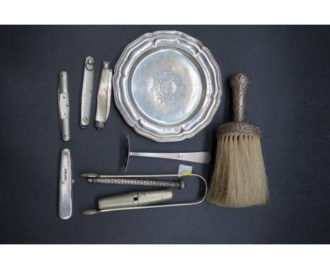 A Chinese white metal child's pusher, decorated bamboo stems; together with a Spanish white metal dish, engraved with crest o