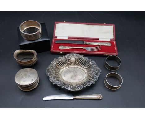 A group of silver and silver mounted items; to include a cased christening knife and fork, 163g weighable. 