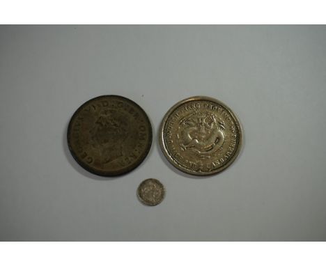 Coins:&nbsp;a George VI 1937 silver crown; together with a William IV 1835 silver 1 1/2p; and a Chinese coin. (3) 
