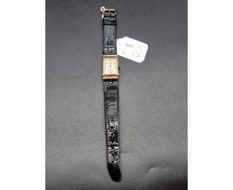 An Art Deco Longines manual wind wristwatch, stamped 14k, cal. 9L, case No. 744789, on black lizard strap. 