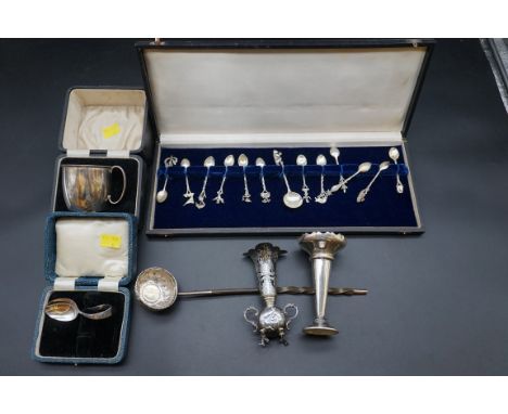 A cased silver mug, by William Suckling Ltd, Birmingham 1932, 6.5cm, 75.8g, together with a cased set of twelve coffee spoons