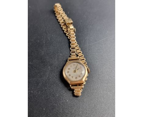 A vintage Record 9ct gold manual wind ladies wristwatch,&nbsp;21mm, cal 103, on Bonklip plated bracelet. 