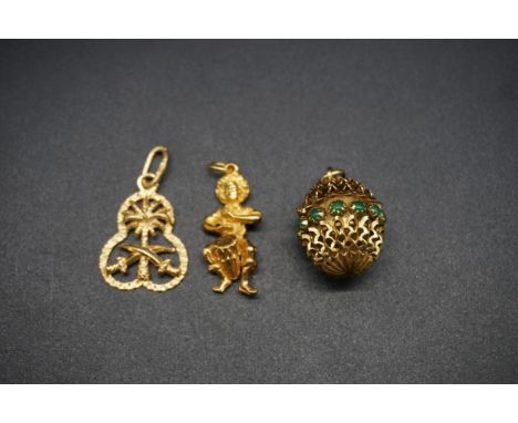 A Saudi Arabian yellow metal pendant, stamped 750; together with an Italian pierced ball pendant set green gems, stamped k18 