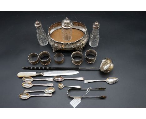 A quantity of silver and silver mounted items; to include five various silver napkin rings; and a baleen handled toddy ladle 