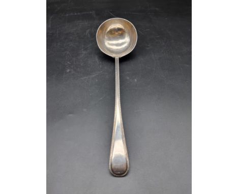 A Victorian silver bead pattern soup ladle, by Chawner &amp; Co, London 1871, 34cm, 274g. 