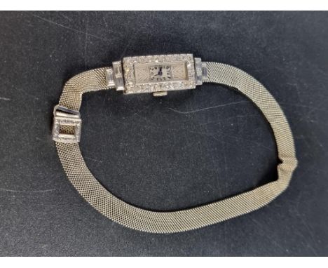 An Art Deco diamond set manual wind wristwatch, stamped platinum, on mesh bracelet, clasp stamped 18ct. 