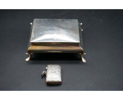 A silver jewellery casket, 11cm; together with a silver vesta case. (2) 