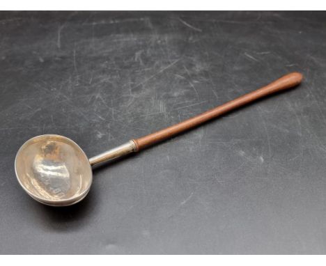 A silver toddy ladle, having turned wooden handle, 32.5cm. 