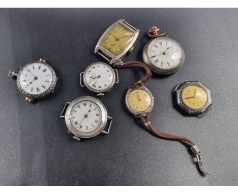 An Art Deco white metal manual wind tonneau wristwatch;&nbsp;25mm, together with six other silver and plated wrist and fob wa