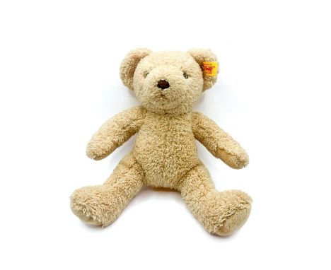 A modern Steiff blonde bear, 'My First Steiff' embroidered to foot, button and label to ear. In good condition.