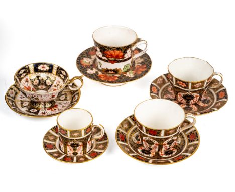 A collection of Royal Crown Derby cups and saucers, including 1283 chocolate cup and saucer, 2451 pattern and two 1128 patter