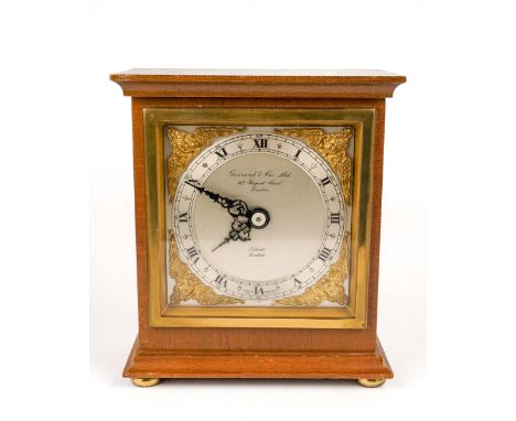 Elliott of London - a giltwood mantel clock, the silvered chapter ring set with Arabic and Roman numerals and inscribed 'Garr