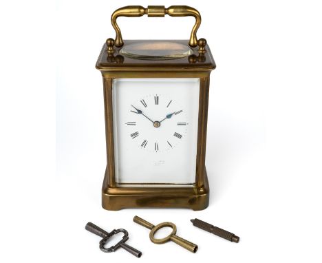 A 19th century brass carriage clock, striking on a gong, with two keys, 13cm high without handle Curently ticking but no warr