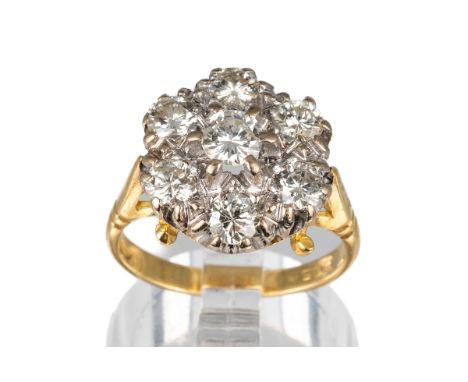 An 18ct yellow gold and diamond seven-stone cluster ring, set with round brilliant-cut diamonds approx 1.2cts, ring size M, t