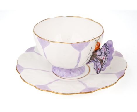 An Aynsley purple butterfly handle cup and saucer, marked to base, Reg No. 765788 Both pieces ring well, no cracks, chips or 