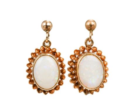 A pair of 9ct yellow gold and opal earrings, oval cabochon opals in rope-twist borders, post and butterfly fittings, total gr