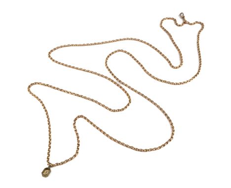 A 9ct yellow gold guard chain, approx 80cm long, with a base metal and paste charm, total gross weight approx 34.1g Good cond