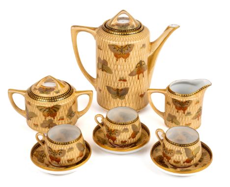 A Japanese eggshell teaset, comprising teapot, milk, sucrier and cover, three cups and saucers, signed to base 