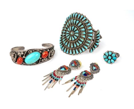 A collection of vintage silver Navajo turquoise set jewellery, to include two bangles, a pair of earrings and a ring (4) In g