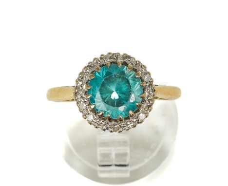 An 18ct yellow gold zircon and diamond cluster ring, the round-cut blue zircon within a border of small round-cut diamonds, s