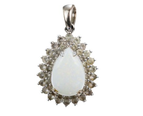 A 14k white gold opal and white sapphire pendant, the pear cabochon white opal approx 2cts, surrounded by round cut white sap