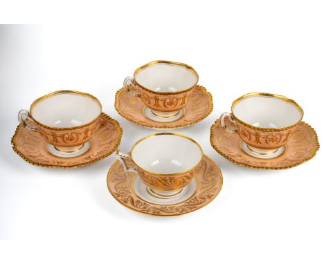 Four Worcester Flight Barr &amp; Barr cups and saucers, early 19th century, gold gilt decoration on salmon ground, stamped to