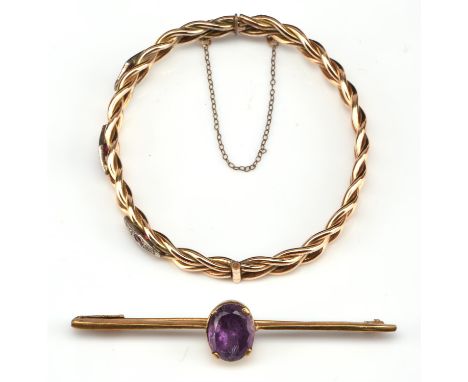 Twist hinged bangle, set with ruby and paste round cut stones fastened with concealed box clip clasp and safety chain measure