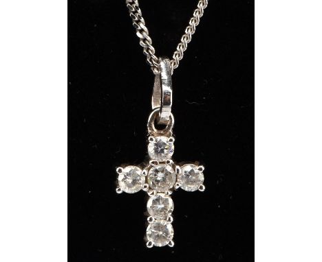 Diamond cross, set with round brilliant cut diamonds, on a fine curb chain, stamped 18 ct, together with a diamond dress ring