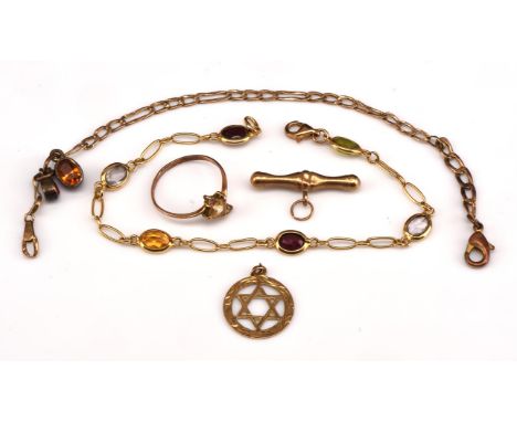 A group of 9 ct jewellery, including a Figaro chain with claddagh charm 47cm long with lobster clasp, a gem set fancy link br