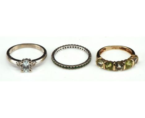 Emerald full eternity ring, in 18 ct white gold, ring size K, a diamond and oval cut aquamarine ring, stamped 9 ct white gold