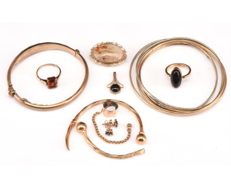 A group of gold jewellery, including a 19 century moss agate brooch with C clasp, stamped 9 ct, a bangle with diamond design,
