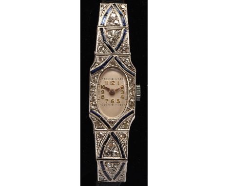 Art Deco diamond and sapphire cocktail watch, with oval dial Arabic numerals and manual wind movement, with a fabric strap wi