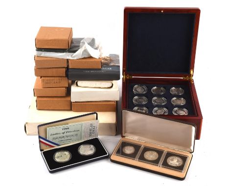 A mixed collection of British and foreign silver proof coins, comprising a cased set of eighteen (18) x £5 2004 Age of Steam 