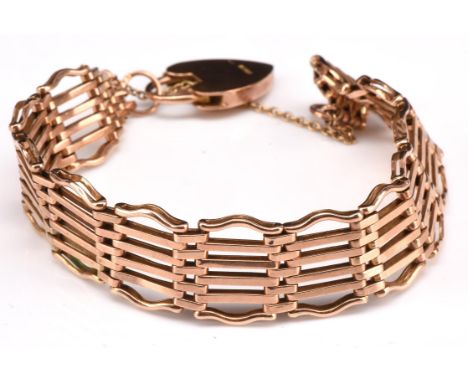 Vintage gold gate bracelet, with heart padlock clasp and  safety chain, stamped 9 ct, 20cm in lengthCondition Report:  9 ct w