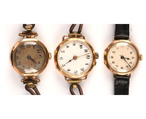 Three Ladies unsigned gold wrist watches with manual wind movements set within hinged  cases, the backs marked inside for 9 c