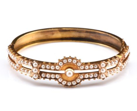 Edwardian pearl set bangle, 63mm in diameter with concealed box clasp, tested as 15 ct, with fitted boxCondition Report:  gro