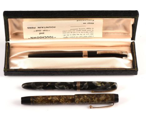 Three vintage fountain pens, including a black cased Sheaffer with original box, a Parker with green and brown resin case and