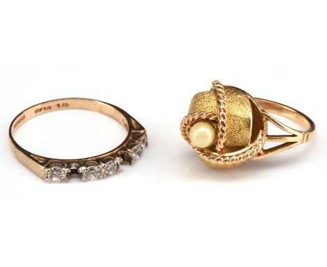Two rings, including a Portuguese pearl dress ring stamped 800 Porto, to the shank size I, with a round cut cubic zirconia ri