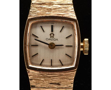 Omega a ladies reference 7115638 gold wristwatch, the signed silvered dial with gold baton hour markers, fitted with a calibr