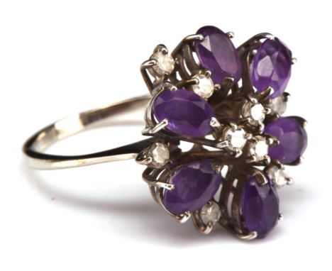 Amethyst and diamond dress ring, set with six oval cut amethysts, in a floral spray design, total estimated diamond weight 0.