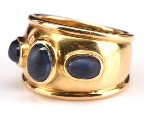 Modern Sapphire dress ring, set with three oval cabochon, on a wide band, hallmarked 18 ct 1994, ring measures size E with ri