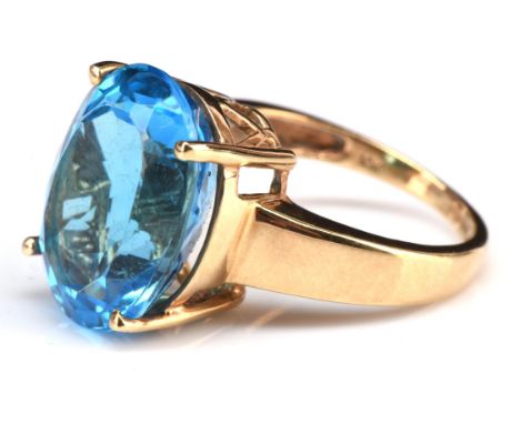 Blue topaz cocktail ring, central oval cut blue topaz, estimated weight 11.73 carats, mount hallmarked 9 ct, ring size LCondi