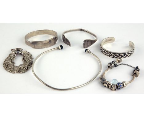 Designer silver jewellery including a Patrick Mavros torque bangle and choker, a Calvin Klein bangle, Bill. J. Wilson bangle,