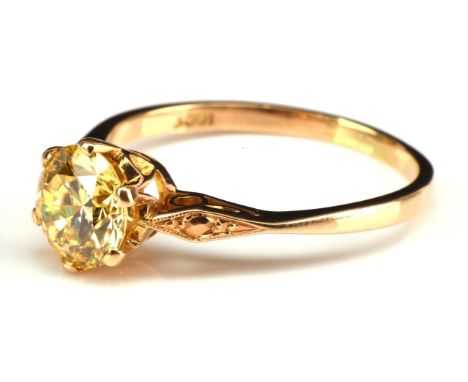 Fancy yellow diamond single stone ring, 1.63 carats round brilliant cut, claw set with six prongs in, mount stamped 18 ct, wi