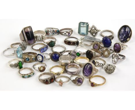 Forty silver and some plated rings of varying sizes, including an art deco style ring set with blue and colourless paste ston